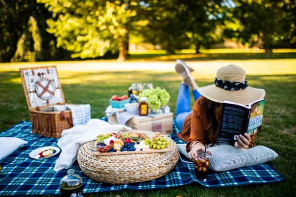 Woman On Picnic Blanket Reading A Book In Newport, RI