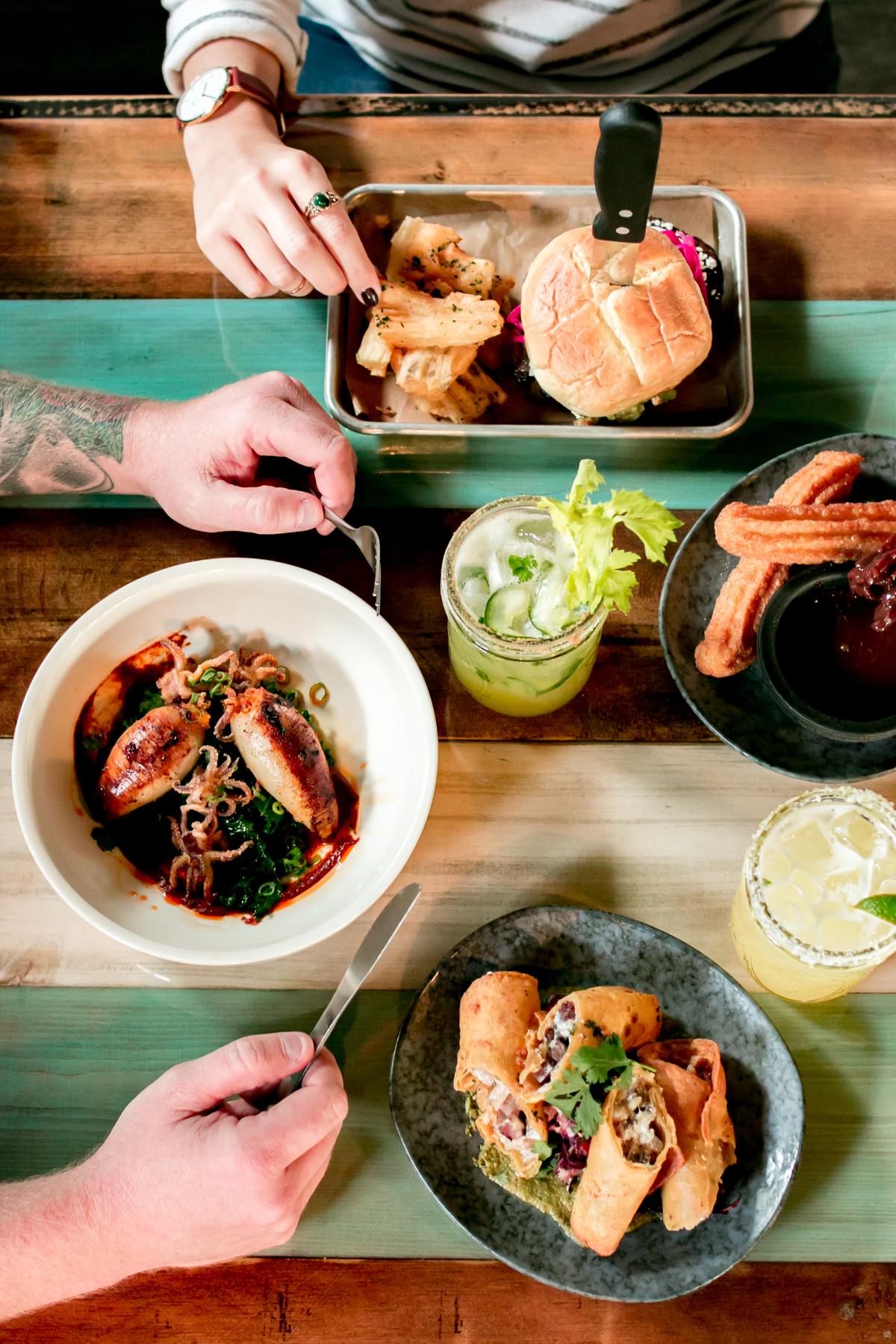 People enjoying plates of food at Diego's Barrio Cantina in Middletown, RI