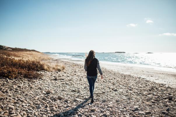 Person walking along the beach in Little Compton, Rhode Island